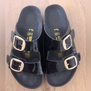 Birkenstock Glossy Black Sandals with Gold Buckles